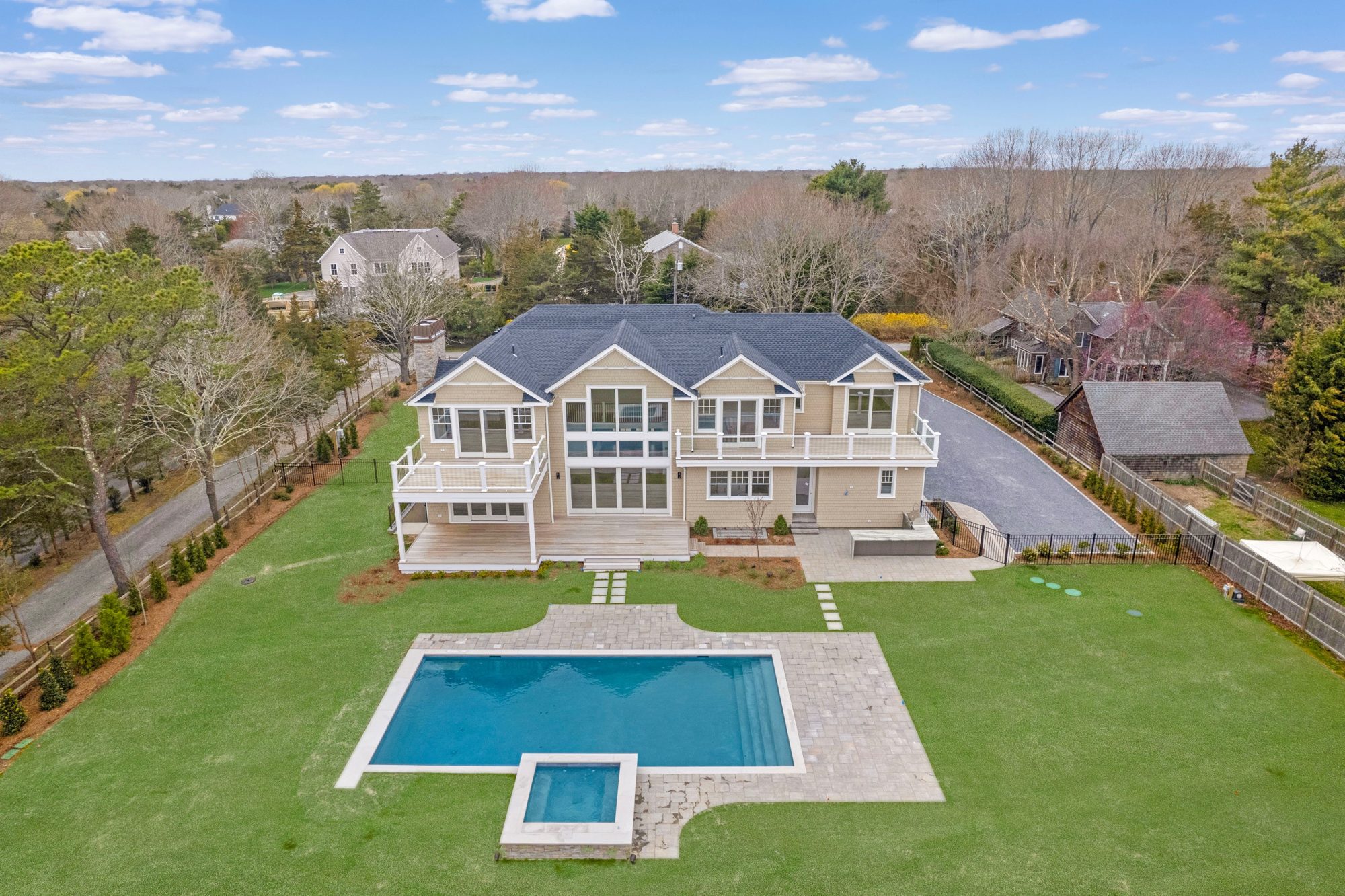 Aerial of a new-construction estate with pool, Westhampton